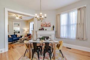 a dining room and living room with a table and chairs at Dauphin District Darling #1-Downtown, Restaurants in Mobile