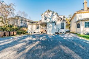 a large white house with a driveway at Dauphin District Darling #1-Downtown, Restaurants in Mobile