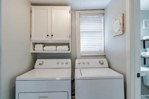 a small kitchen with two white appliances in it at Dauphin District Darling #4 Downtown, Dining in Mobile