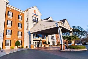 a hotel with awning in front of a building at Comfort Suites Newport News Airport in Newport News