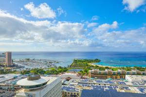 an aerial view of a city and the ocean at Renaissance Residences Oahu Honolulu in Honolulu