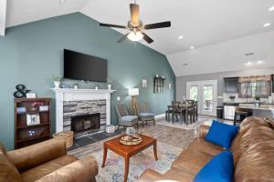 a living room with a couch and a fireplace at Laid-Back on Lancelot Lane in Clarksville