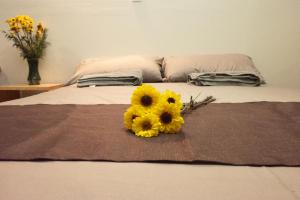 Una cama o camas en una habitación de Casa NAU Mazunte