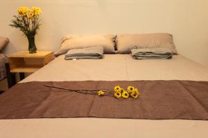 Una cama o camas en una habitación de Casa NAU Mazunte
