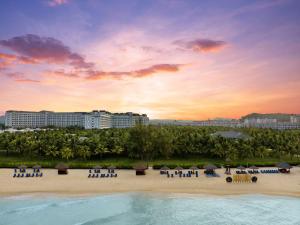 a view of a resort with a pool and chairs at Radisson Blu Resort Phu Quoc in Phú Quốc