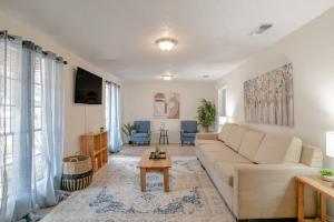 a living room with a couch and a table at Parkhill Place- Mins from University of South AL in Mobile