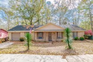 a house with palm trees in front of it at Parkhill Place- Mins from University of South AL in Mobile