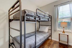 a bedroom with two bunk beds and a lamp at Covered Patio & Fenced Yard Lovely in Laurelwood in Savannah