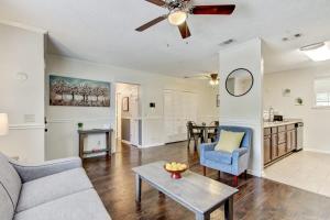 a living room with a couch and a table at Covered Patio & Fenced Yard Lovely in Laurelwood in Savannah