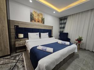 Кровать или кровати в номере Nurel Shark Residence