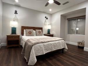 a bedroom with a bed with two lamps on it at Spacious & Beautiful with Double Decks in Chapel Area in Sedona