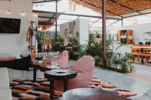 a room with two chairs and a table in a store at La Tribu in Puerto Viejo