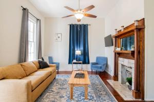 a living room with a couch and a fireplace at Paradise Near the Port in Mobile