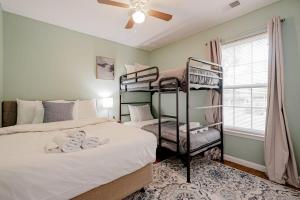 a bedroom with two bunk beds and a window at Close to USC & Midtown-Downtown - Newly Renovated in Columbia