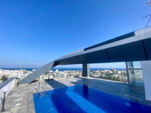 a swimming pool on the roof of a house at Nurel Shark Residence in Kyrenia