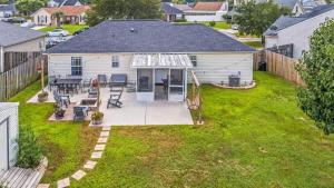 an aerial view of a backyard with a house at Screened Porch Firepit Patio Peaceful in Pooler in Savannah