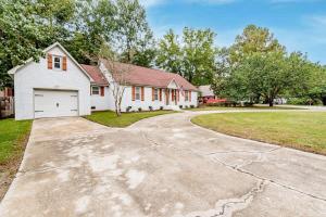 a large white house with a driveway at Settle Inn-- 10mi to Columbia, Mins to Lake Murray in Irmo