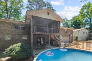 a house with a large swimming pool in front of it at The Monterey Maison-20min N of Downtown, 6BR in Birmingham
