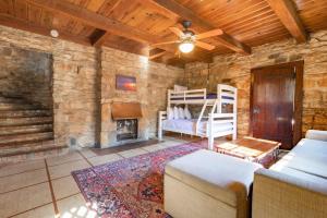a living room with a bed and a fireplace at Royal in Columbus- Midtown Columbus Castle in Columbus +59 photos