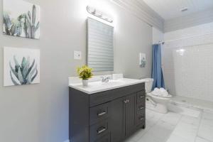a bathroom with a sink and a toilet at Near Downtown Parks & Museum - Midtown Two-Units in Columbus