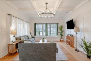 a living room with a couch and a tv at Mins to Cruise Terminal&Downtown- Sunny Splendor in Mobile