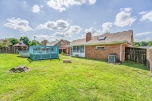 a house with a yard with a fence at Fenced Yard - Comfy & Convenient in Cordova in Memphis