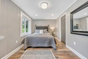 a bedroom with a bed and a window at Cottage in the Pines in Rocky Mount