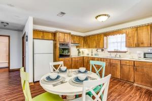 a kitchen with a table and chairs in a kitchen at Brilliant in Bellview-Back unit-- Mins to NAS Pensacola, Beach, Shopping in Pensacola