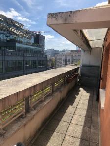 an empty ledge of a building with a view at Appartement avec terrasse in Saint-Ouen