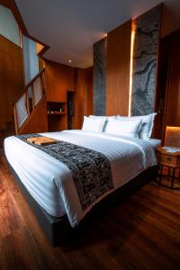 Giường trong phòng chung tại Hotel Le Temple Borobudur