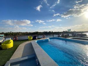 a swimming pool on the roof of a building at Cleopatra Nile Cruise From Luxor 3&4 Nights Every Saturday and Monday, Thursday in Luxor