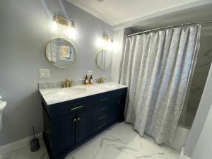 A bathroom at It’s Showtime-Book Lally’s House! Steps to Common!