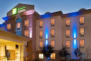 a hotel building with a sign on it at Holiday Inn Express Fort St John by IHG in Fort Saint John