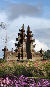 a monument with flowers in front of a building at The Blooms Villas in Bedugul