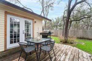 a patio with a table and chairs and a grill at Pet-Friendly Southwest Austin Home with BBQ in Austin