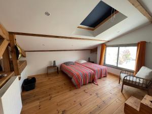 a bedroom with a bed and a large window at Appartement Arcachon, 5 pièces, 8 personnes - FR-1-420-130 in Arcachon