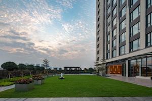 a rendering of the courtyard of a building at Holiday Inn Shunde, an IHG Hotel in Shunde