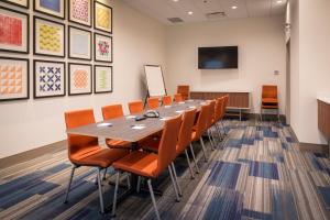 a conference room with a long table and chairs at Holiday Inn Express & Suites Victoria-Colwood, an IHG Hotel in Victoria