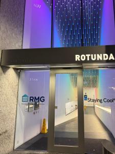 a entrance to a building with a revolving door at Birmingham City Centre Rotunda. in Birmingham