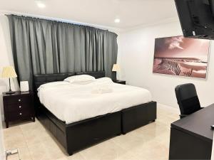 Ένα ή περισσότερα κρεβάτια σε δωμάτιο στο Spacious 4/4 Home Central To All Attractions