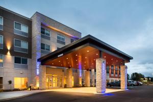 a large building with a parking lot in front of it at Holiday Inn Express & Suites Terrace by IHG in Terrace