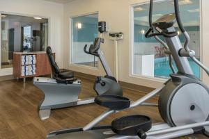 a gym with two elliptical machines in a hotel room at Holiday Inn Express Hotel & Suites North Bay, an IHG Hotel in North Bay