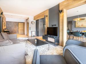 a living room with a couch and a table at Appartement Tignes, 4 pièces, 6 personnes - FR-1-641-38 in Tignes