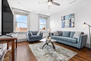 a living room with a couch and a table at Brand new luxury 2BR loft in downtown Johnson City in Johnson City