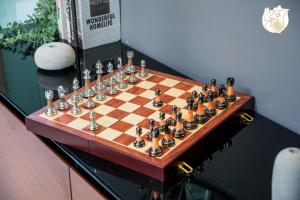 a chess board on top of a table at 6BR Homestay KL Pool Villa - 4KM To KLCC by Verano in Ampang