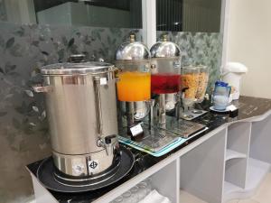 a counter with two blenders on a counter with some drinks at Morakot Twin Chumphon in Chumphon