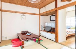 Postel nebo postele na pokoji v ubytování 板東ビル