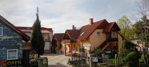 a row of houses with brown roofs at Pokoje Gościnne Jaga in Bielsko-Biała