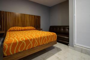 Postel nebo postele na pokoji v ubytování Hotel El Rincón
