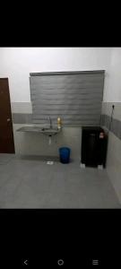a bathroom with a sink and a toilet at Bahau ioi homestay in Bahau